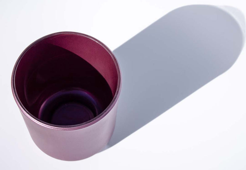 This image shows an interior view of a glass opaque candle vessel